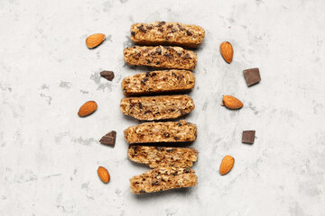 Tasty biscotti cookies, almond nuts and chocolate on grey table