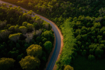 Aerial image of a road through a forest in South East Asia, Aerial view of a provincial road through a forest, Background information on ecosystems and a healthy environment, Thailand. Generative AI