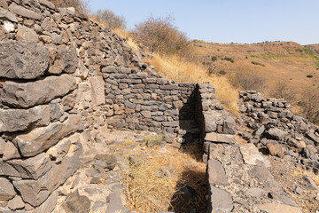 Remains  of buildings and stone walls on the ruins of the Gamla city, Golan Heights, northern Israel