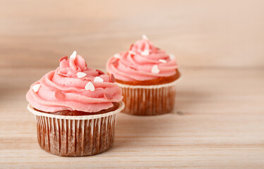 Tasty cupcake for Valentine's Day on wooden background, closeup