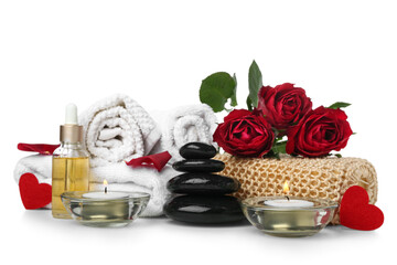 Fototapeta na wymiar Spa composition for Valentine's Day with stones, candles and roses on white background