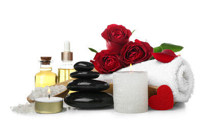 Fototapeta na wymiar Spa composition for Valentine's Day with stones, candles and roses on white background