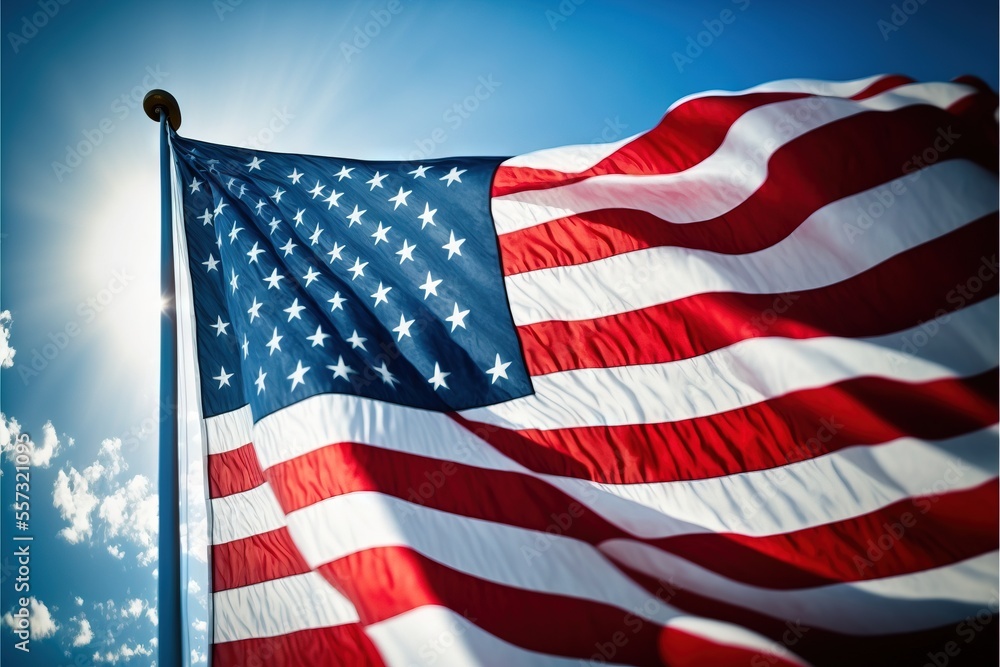 Poster a large american flag flying in the sky with a sun in the background and clouds in the sky behind it