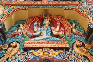 Fototapeta premium Shiva and Parvati in one body. Scenery above the entrance to a Hindu temple in Puri, Odisha, India.
