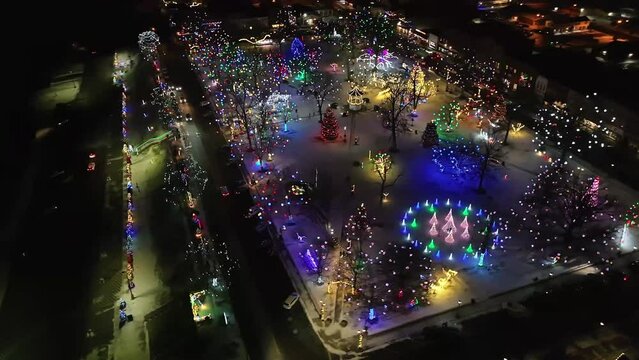 Christmas lights in city park, aerial view.
