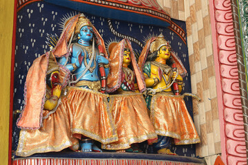 Sita, Rama and Lakshman - the divine family on the wall of the temple in Puri, Orissa, India.