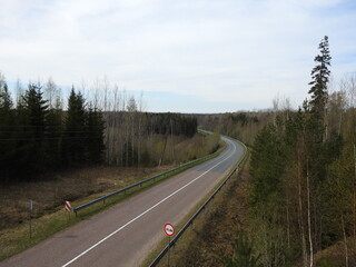 Fototapeta na wymiar Asphalted highway road in nature forest arial view