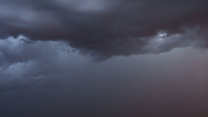 Obraz premium Detail shot of epic storm clouds during sunrise