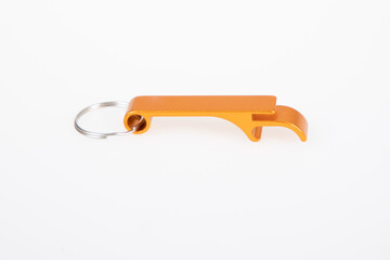 bottle opener key ring chain orange steel on white background - obrazy, fototapety, plakaty