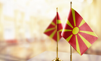 Small flags of the Macedonia on an abstract blurry background