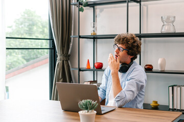 Young Businessman feel sleepy in workplace