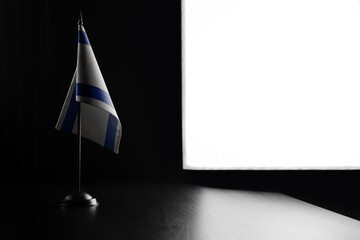 Small national flag of the Israel on a black background