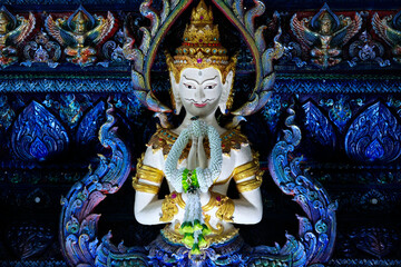 Fototapeta premium Detail of sculpture in Wat Rong Suea Ten, Temple of the Dancing Tiger, in the blue buddhist temple -Chiang Rai-Thailand