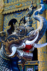 Fototapeta premium Detail of dragon in Wat Rong Suea Ten, Temple of the Dancing Tiger, in the blue buddhist temple -Chiang Rai-Thailand