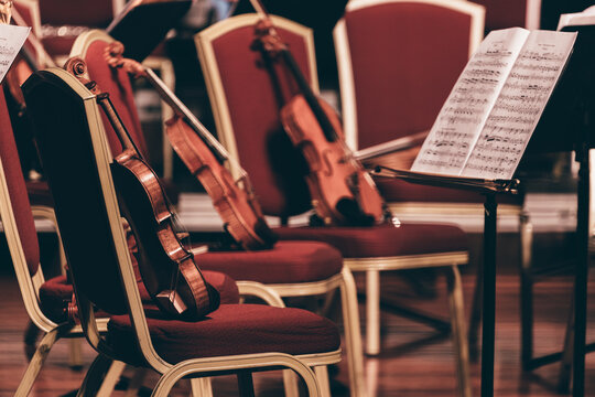 Indoor Concert Background Abstract People Performing Music Instruments In Symphony Orchestra Violin