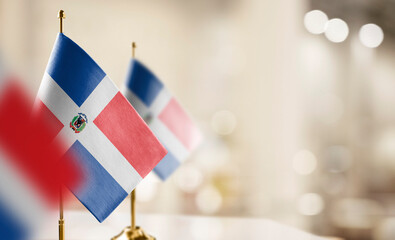 Small flags of the Dominicana on an abstract blurry background