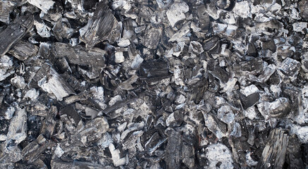 Burned wood texture. Black background, Details on the surface of charcoal, burnt wood texture,...
