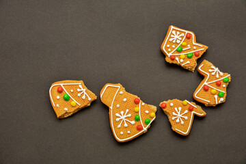 Christmas gingerbread cracked cookie on a dark background .