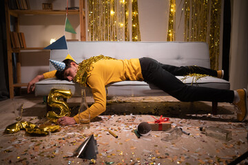 Drunk man sleep in room after birthday party - obrazy, fototapety, plakaty