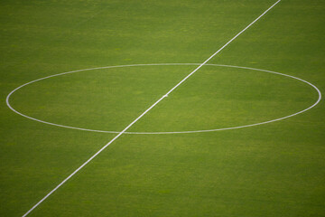 Obraz premium Center circle of Soccer ground. Center, midfield. Centerline on grass and kick-off point.