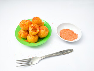 Round Tofu is a favourite snack from Indonesia which is made from fried round tofu sprinkled with chilli, salt and Balado seasoning