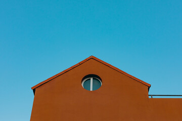 orange house roof with blue sky background