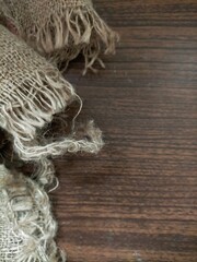 Knitting rope on wooden background