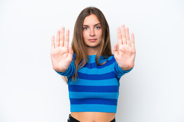 Young caucasian woman isolated on white background making stop gesture and disappointed