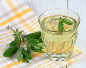 Herbal tea made from sage, Salvia officinalis.   It can be used for gargling against sore throat, even for smooth and healthy skin.