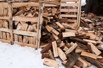 Wooden box with firewood. Chopped and hand-folded in a crate for sale or for storage in a cottage. transport by pallet truck.