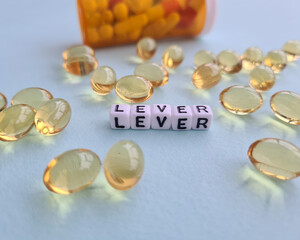 Omega 3-6-9 fish oil yellow softgels capsules and healthy liver