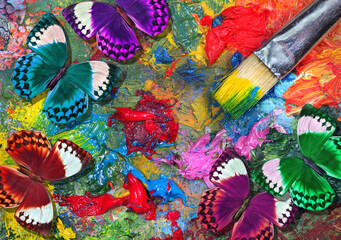 color concept. colors of rainbow. colorful tropical morpho butterflies on an artist's palette with...