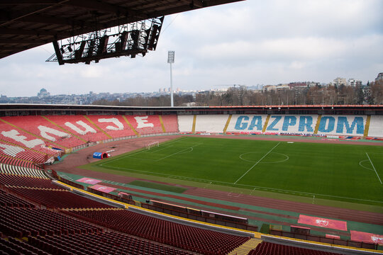 Football club Red Star Belgrade empty stadium. Delije sector and city skyline in the background. Belgrade, Serbia 18.12.2022