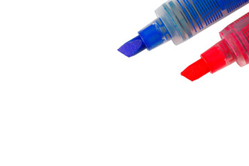 Two chisel shaped markers, a blue chisel marker and a pink chisel marker isolated on a white background with copy space