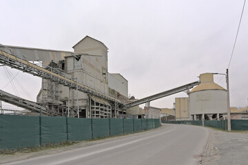 Silo`s and conveyor belts of a stone quarry in LEssines, Wallonia, Belgium 