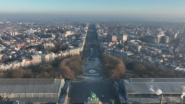 Jubelpark, Park of the Fiftieth Anniversary in Brussels, Belgium. Europe. Urban monumental park, aerial drone overhead city skyline view. Arc de Triomphe, Cinquantenaire park. Winter day.