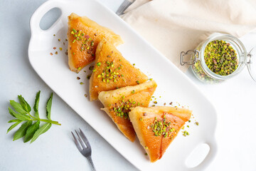 Traditional Turkish desserts; custard triangular dessert, albanian dessert ( Turkish name; Arnavut tatlisi or muhallebili muska tatlisi)