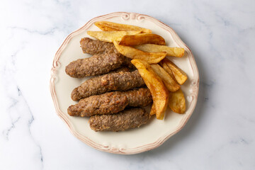 Traditional Turkish food; dry meatballs or inegöl meatballs with potatoes (Turkish name; Kuru kofte or anne koftesi)