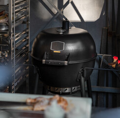 Closeup Of Black Ceramic BBQ Grill in Open kitchen, street food preparation place