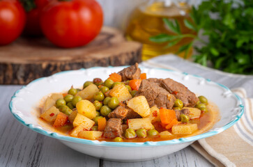 Turkish Food Green Pea Stew with Meatballs - Kofte or Kofta Bezelye. (Turkish name; kofteli bezelye)