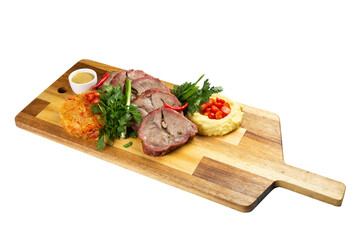 Cooked tenderloin meat and mashed potatoes on a wooden board. transparent