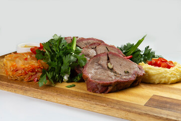 Cooked tenderloin meat and mashed potatoes