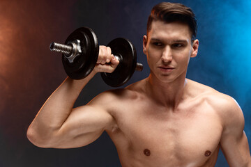 Naklejka na ściany i meble Portrait young fitness sporty strong man bare-chested muscular sportsman isolated