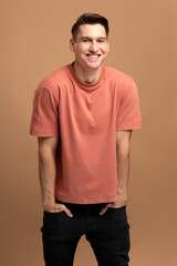 Portrait of happy successful caucasian man standing, looking at camera with positive smile