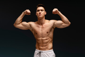 Fototapeta na wymiar Portrait of handsome shirtless man looking to camera while standing