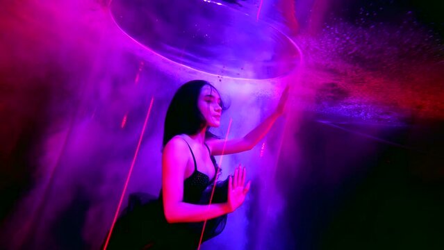 erotic fantasy about slender sexy brunette woman underwater, go-go dancer in water tube in pool