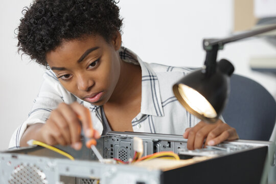 female technician repairing a computer