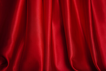Bright red curtains are beautifully wavy, close-up.