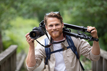 man photographer hand holding dslr camera