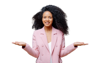 Isolated shot of cheerful female business worker with Afro hairstyle, wears elegant formal violet jacket, raises both palms, presents some product, smiles pleasantly, isolated over grey background.
